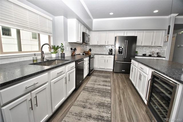 kitchen featuring white cabinetry, sink, wine cooler, and black appliances