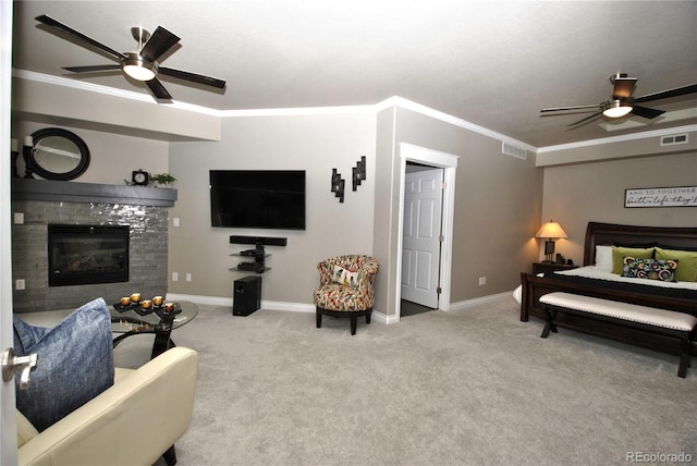 carpeted bedroom with a fireplace, ornamental molding, and ceiling fan