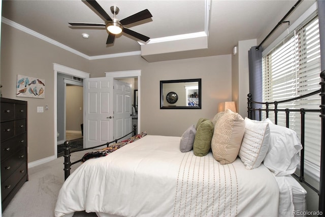 bedroom with light carpet, ornamental molding, and ceiling fan