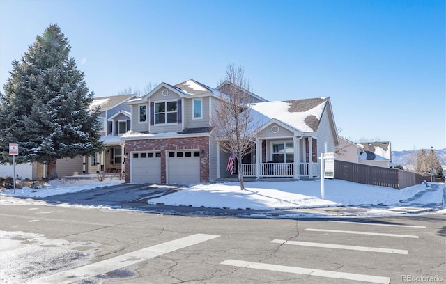 front of property featuring a porch and a garage