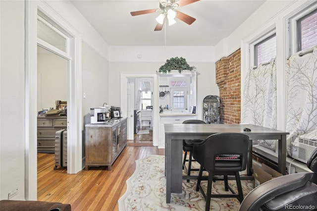 office featuring ceiling fan and light hardwood / wood-style flooring