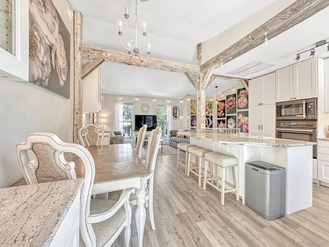 dining room with light hardwood / wood-style flooring