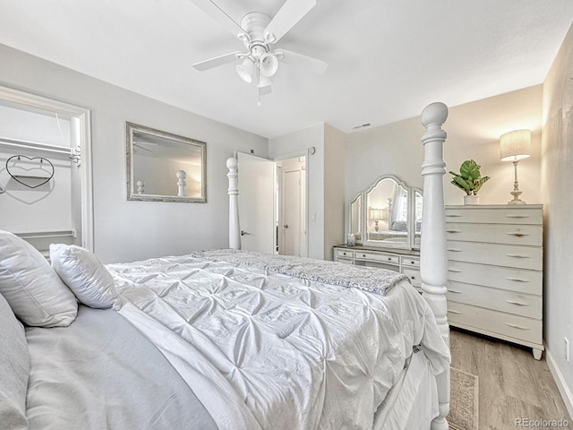 bedroom with ceiling fan and light hardwood / wood-style floors