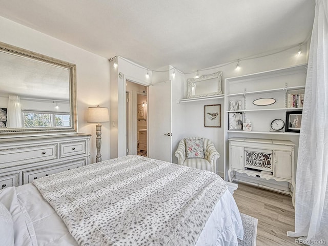 bedroom with light wood-type flooring