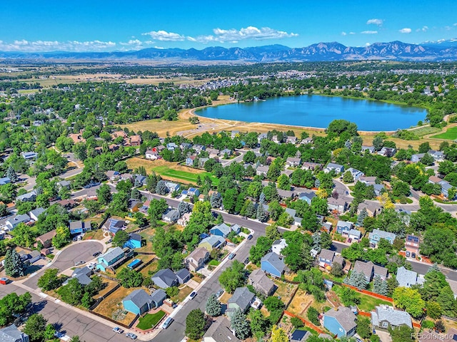 birds eye view of property featuring a water and mountain view