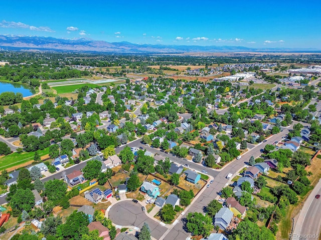 aerial view featuring a water and mountain view