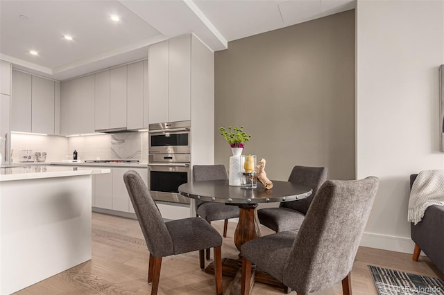 dining room with light hardwood / wood-style floors