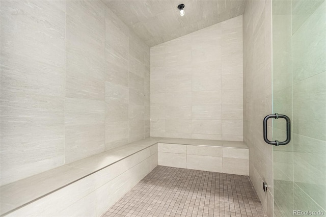 bathroom with a shower with shower door