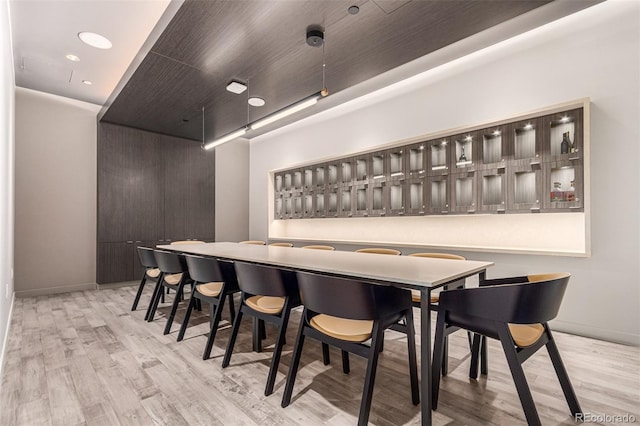 bar with light wood-type flooring