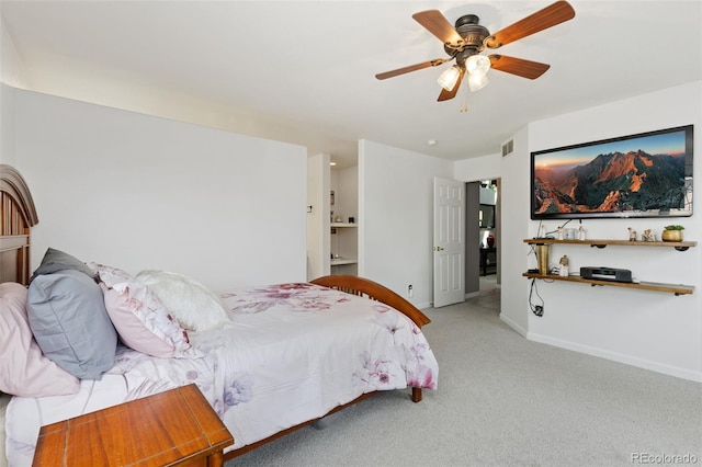 carpeted bedroom with baseboards, visible vents, and ceiling fan