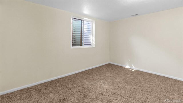 spare room featuring carpet floors