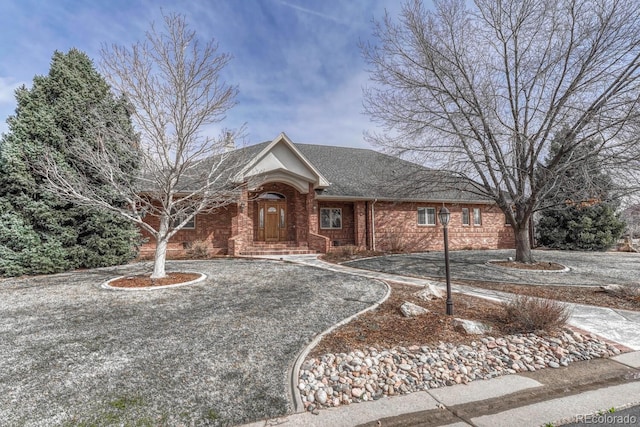 14581 E Oberlin Pl, Aurora, CO 80014 - single story home with brick siding and a shingled roof