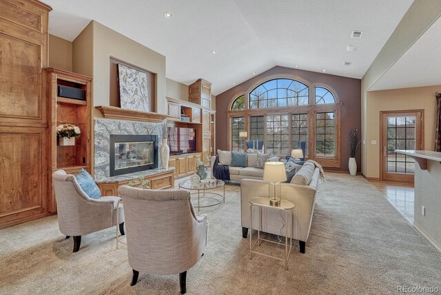 14581 E Oberlin Pl, Aurora, CO 80014 - living room with light colored carpet, vaulted ceiling, and a high end fireplace