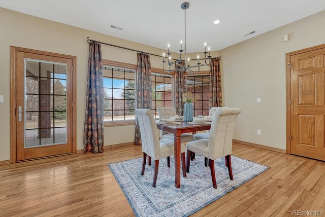 14581 E Oberlin Pl, Aurora, CO 80014 - dining space with light wood-style floors, a chandelier, baseboards, and recessed lighting