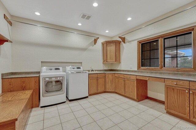 14581 E Oberlin Pl, Aurora, CO 80014 - laundry room with washer and clothes dryer, recessed lighting, light tile patterned flooring, and cabinet space