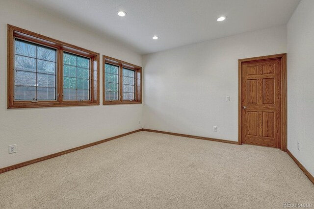 14581 E Oberlin Pl, Aurora, CO 80014 - spare room featuring baseboards, light carpet, and recessed lighting