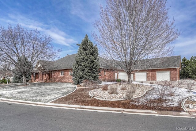 14581 E Oberlin Pl, Aurora, CO 80014 - ranch-style home with brick siding, driveway, a garage, and a shingled roof