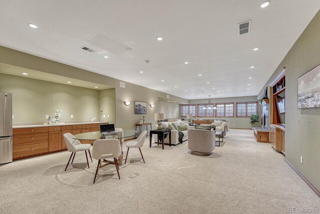 14581 E Oberlin Pl, Aurora, CO 80014 - dining room featuring light carpet, recessed lighting, and baseboards