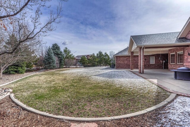 14581 E Oberlin Pl, Aurora, CO 80014 - view of green lawn with a patio area