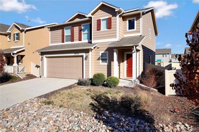 10733 Calista Way, Fountain, CO 80817 - view of front facade with fence, a garage, and driveway