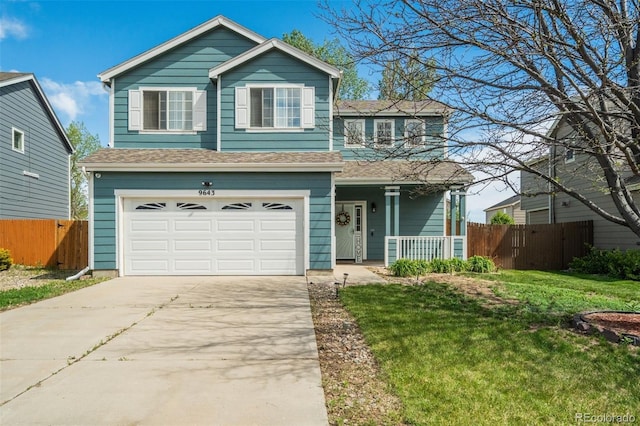 9643 Yukon Way, Colorado Springs, CO 80925 - view of front of home featuring covered porch, a garage, driveway, and roof with shingles