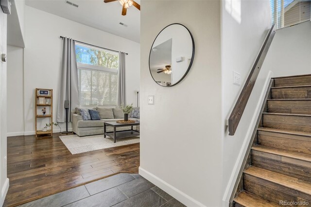 9643 Yukon Way, Colorado Springs, CO 80925 - stairs with a ceiling fan, baseboards, and wood finished floors