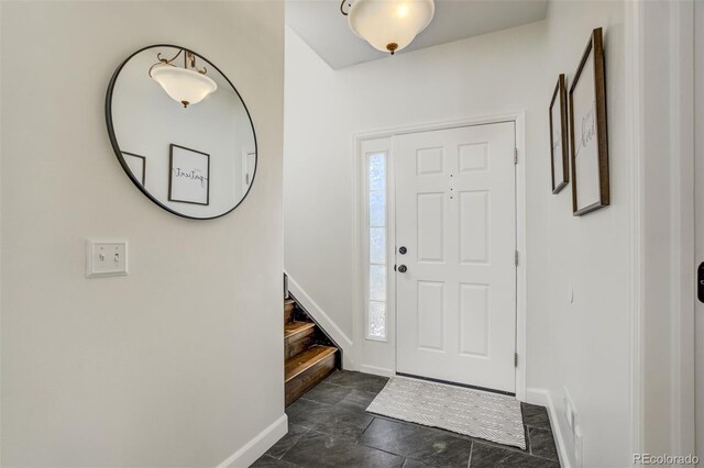 9643 Yukon Way, Colorado Springs, CO 80925 - entrance foyer featuring baseboards and stairs