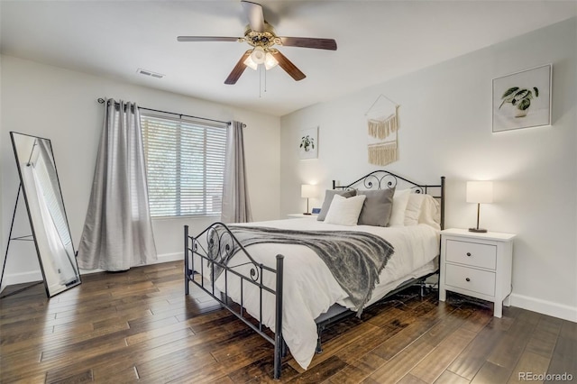 9643 Yukon Way, Colorado Springs, CO 80925 - bedroom featuring baseboards, dark wood-type flooring, and a ceiling fan