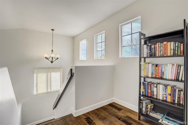 9643 Yukon Way, Colorado Springs, CO 80925 - stairway with a chandelier, wood finished floors, baseboards, and vaulted ceiling