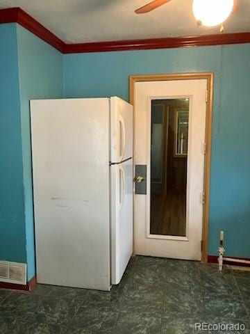 kitchen featuring white refrigerator, crown molding, and ceiling fan