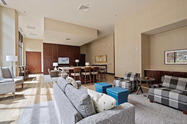 living room with light hardwood / wood-style flooring