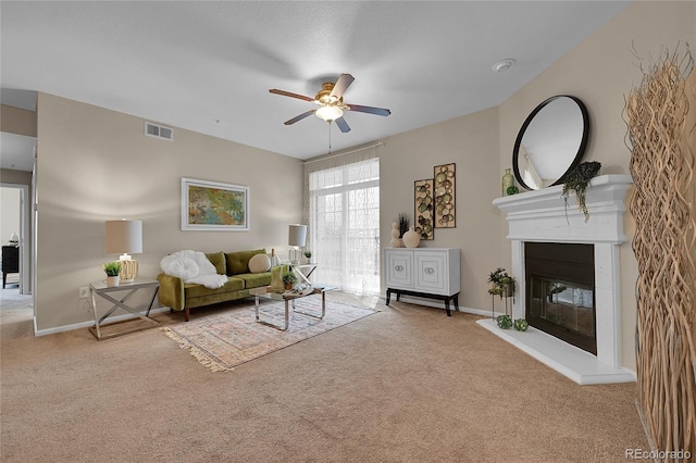 3852 S Dallas St Unit 8-102, Aurora, CO 80014 - carpeted living area featuring ceiling fan and a glass covered fireplace