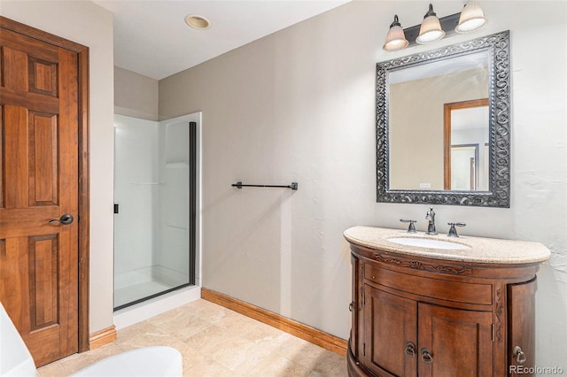 bathroom with vanity and a shower with door