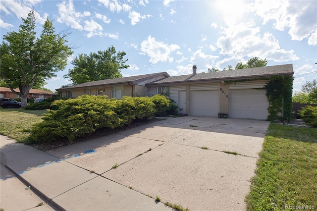 6579 S Lincoln St, Centennial, CO 80121 - single story home with driveway, a garage, and brick siding