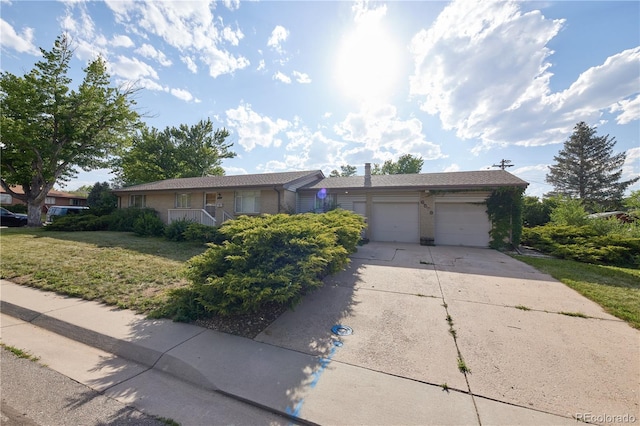 6579 S Lincoln St, Centennial, CO 80121 - single story home featuring concrete driveway, a garage, a front yard, and brick siding