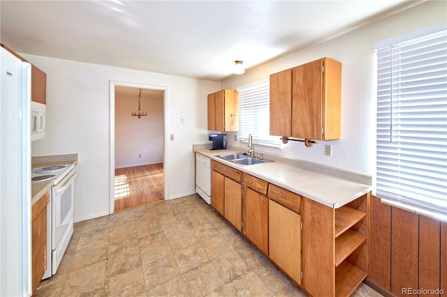 6579 S Lincoln St, Centennial, CO 80121 - kitchen with white appliances, light countertops, open shelves, and brown cabinetry