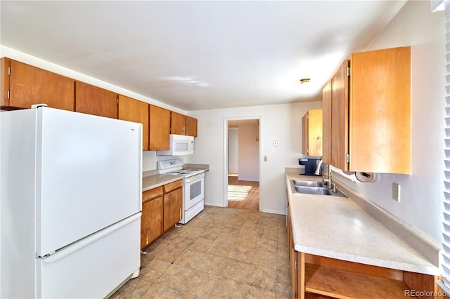 6579 S Lincoln St, Centennial, CO 80121 - kitchen with white appliances, light countertops, and brown cabinetry