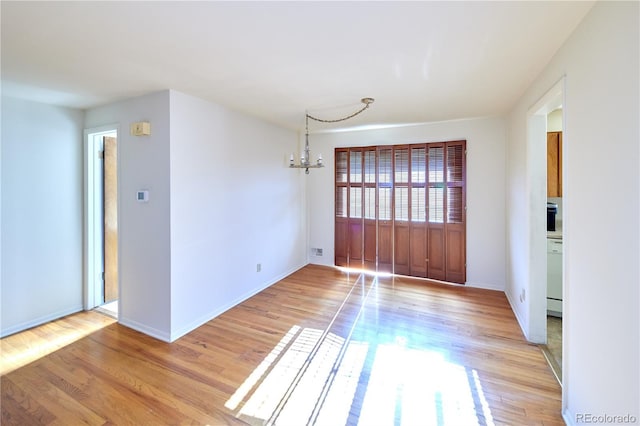 6579 S Lincoln St, Centennial, CO 80121 - unfurnished room with light wood-style flooring and a chandelier