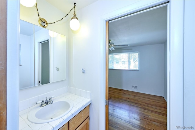 6579 S Lincoln St, Centennial, CO 80121 - bathroom featuring vanity, wood finished floors, and ceiling fan