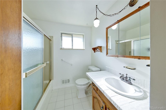 6579 S Lincoln St, Centennial, CO 80121 - full bathroom featuring vanity, tile patterned flooring, and shower / bath combination with glass door