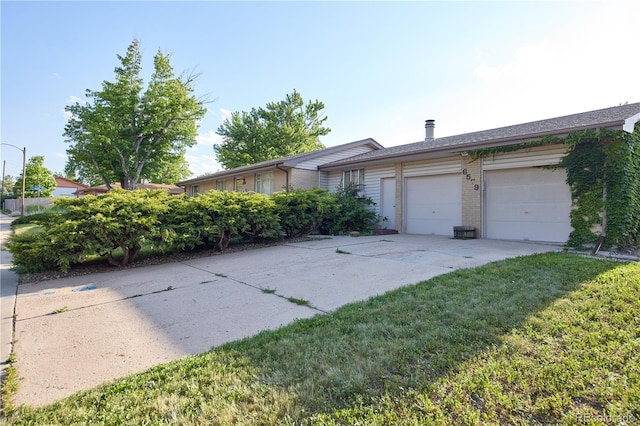 6579 S Lincoln St, Centennial, CO 80121 - view of front of property with concrete driveway, an attached garage, brick siding, and a front yard