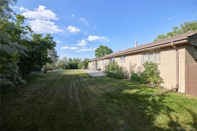 6579 S Lincoln St, Centennial, CO 80121 - view of grassy yard featuring a patio