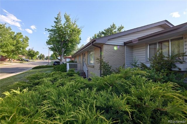 6579 S Lincoln St, Centennial, CO 80121 - view of side of home with brick siding