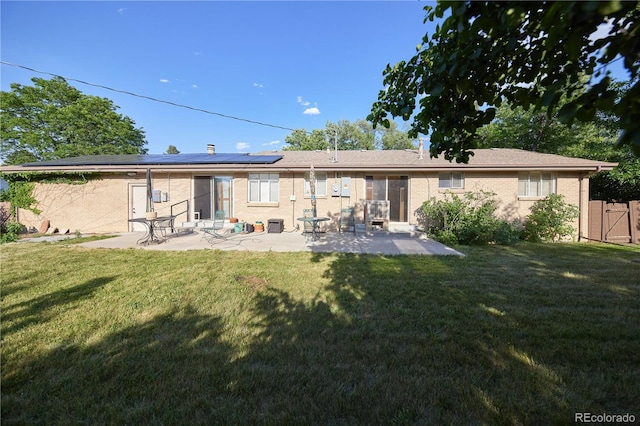 6579 S Lincoln St, Centennial, CO 80121 - rear view of property with a patio area, solar panels, and brick siding