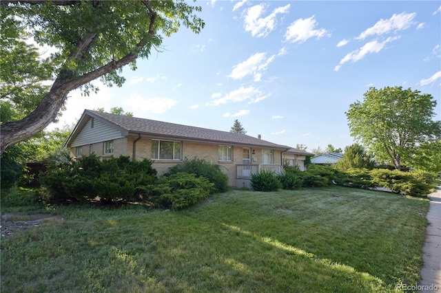 6579 S Lincoln St, Centennial, CO 80121 - view of side of property with a lawn and brick siding