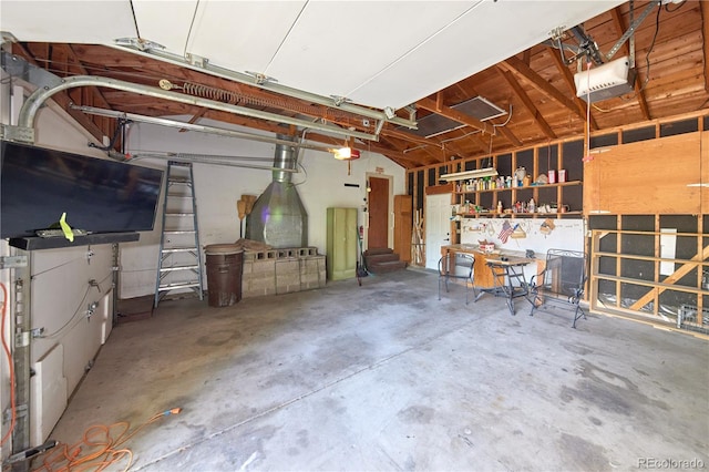 6579 S Lincoln St, Centennial, CO 80121 - garage featuring a garage door opener and a workshop area