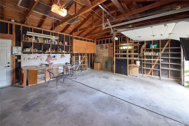 6579 S Lincoln St, Centennial, CO 80121 - garage with a garage door opener and a workshop area