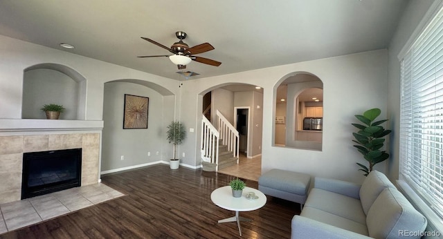 1254 Carlyle Park Cir, Highlands Ranch, CO 80129 - living room with wood finished floors, a tile fireplace, ceiling fan, healthy amount of natural light, and recessed lighting