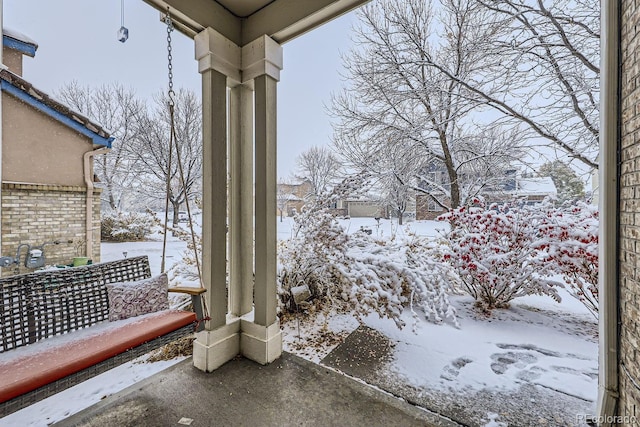 view of yard layered in snow