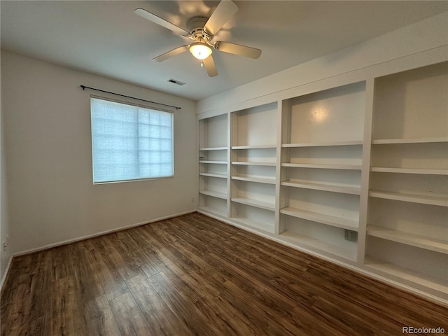 unfurnished room with visible vents, ceiling fan, baseboards, and wood finished floors